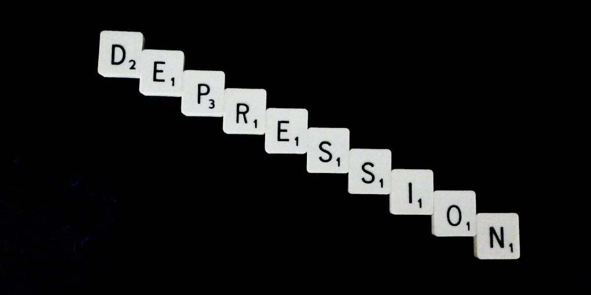 Depression, spelled out in white scrabble tiles.