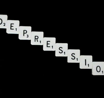 Depression, spelled out in white scrabble tiles.