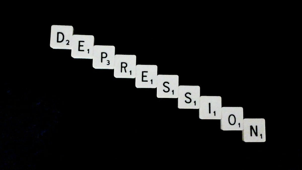 Depression, spelled out in white scrabble tiles.